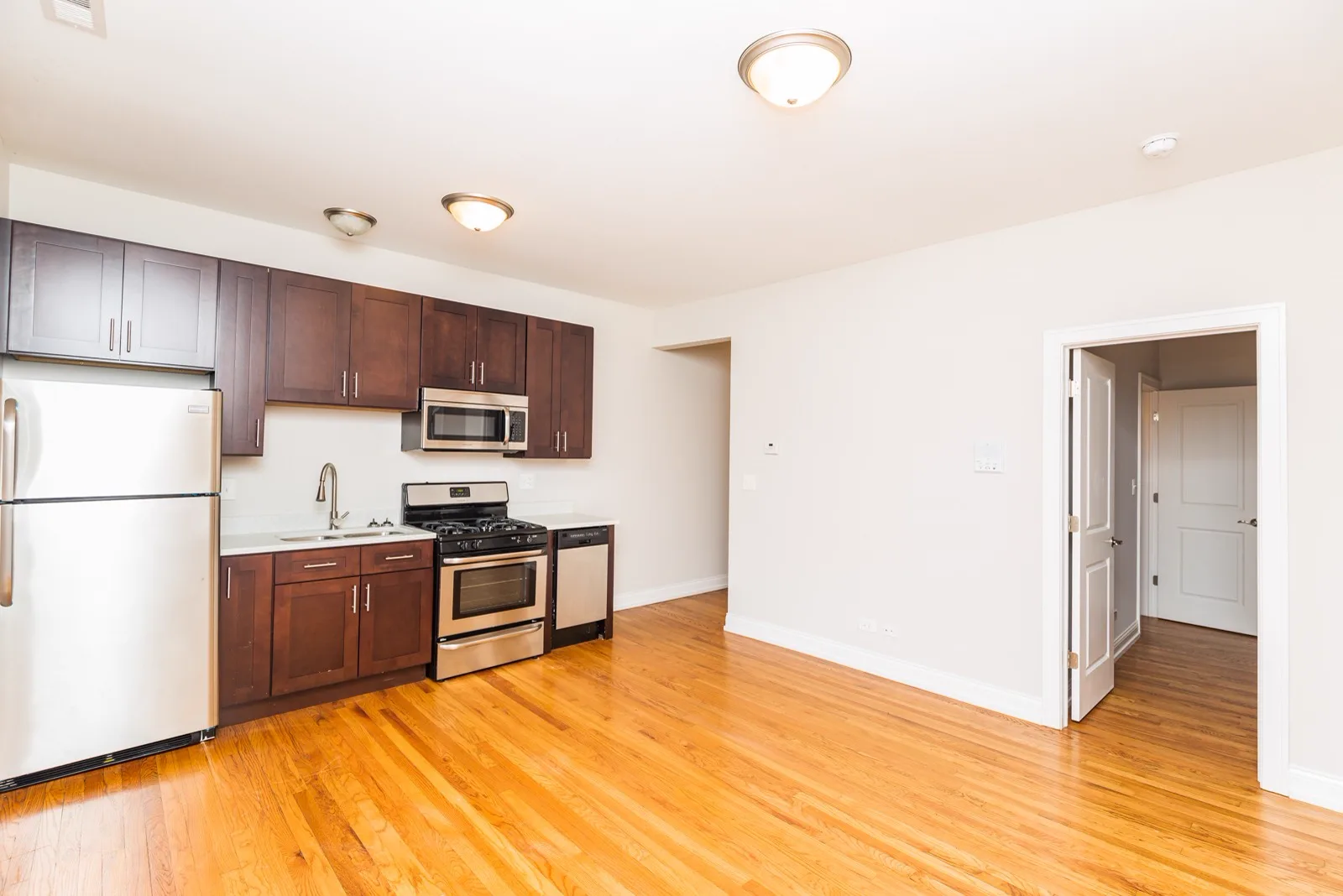 Kitchen with cherry cabinets and stainless steel appliances
