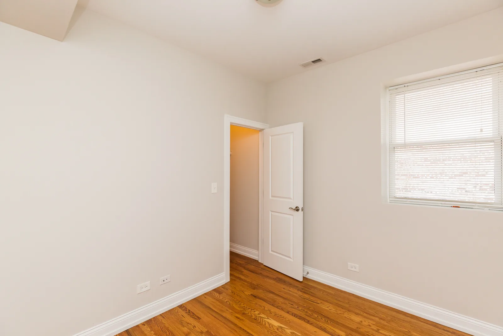 Bedroom with hardwood floors